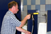 Practicing his Process Cleaning technique, Rex Morrison, former facilities management specialist at Washoe County School District, Reno, Nev., tackles the restroom using touch-free cleaning techniques. <br />
