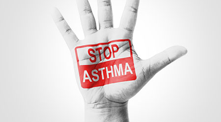 Open hand raised, Stop Asthma sign painted