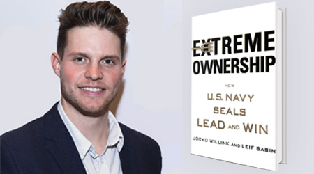 Headshot of a smiling man next to a book he reviewed