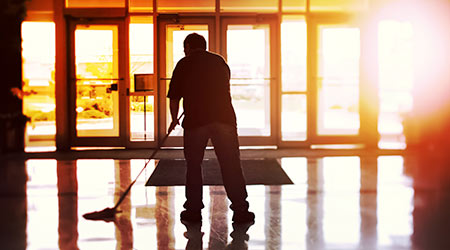 Janitor mopping an office floor