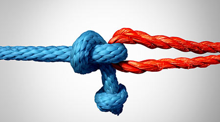 Connected concept as two different ropes tied and linked together as an unbreakable chain as a trust and faith metaphor for dependence and reliance on a trusted partner for support and strength