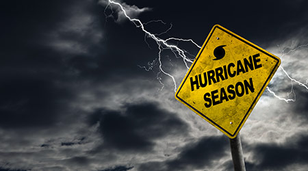 Hurricane season with symbol sign against a stormy background and copy space.