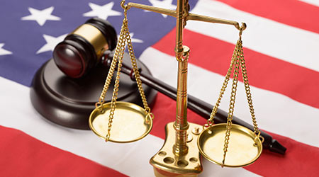 Justice Scale And Wooden Brown Gavel On Usa Flag