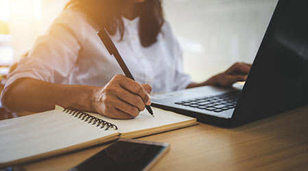 young woman with learning language during online courses using netbook