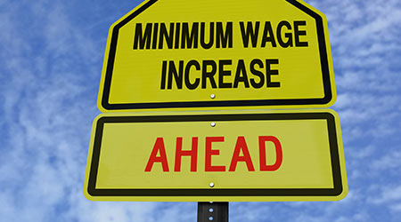 A fake traffic sign warning of wage increases