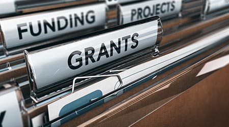 Brown folder related to funding and grants