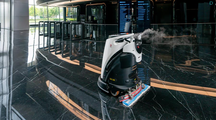 automatic AI cleaner mopping floor inside of modern office building.