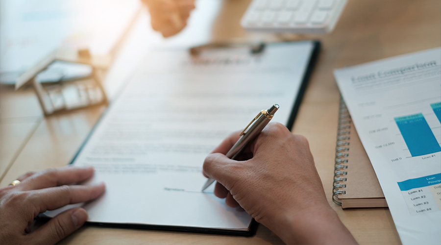 After a discussion in a exclusive room at the corporate , a businessman and his partner sign a contract investment professional paper agreement.